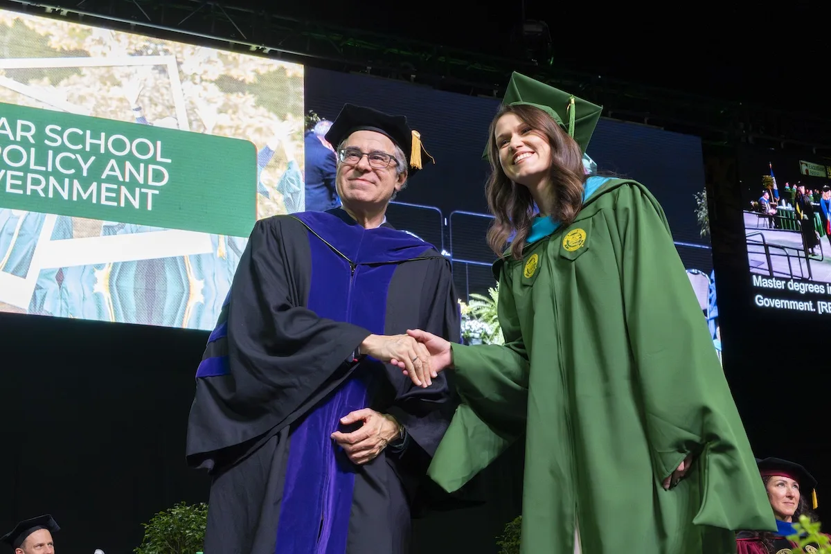 Mark Rozell, dean of the Schar School of Policy and Government, presents the degree candidates during the Winter Degree Celebration on December 18, 2025, at EagleBank Arena.