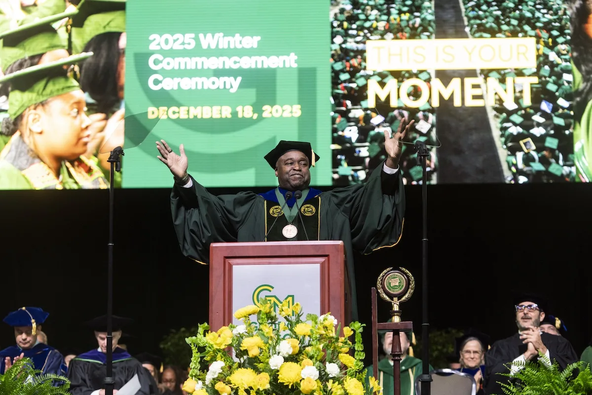 President Gregory Washington gives welcoming remarks during the 2025 Winter Commencement at EagleBank Arena. 