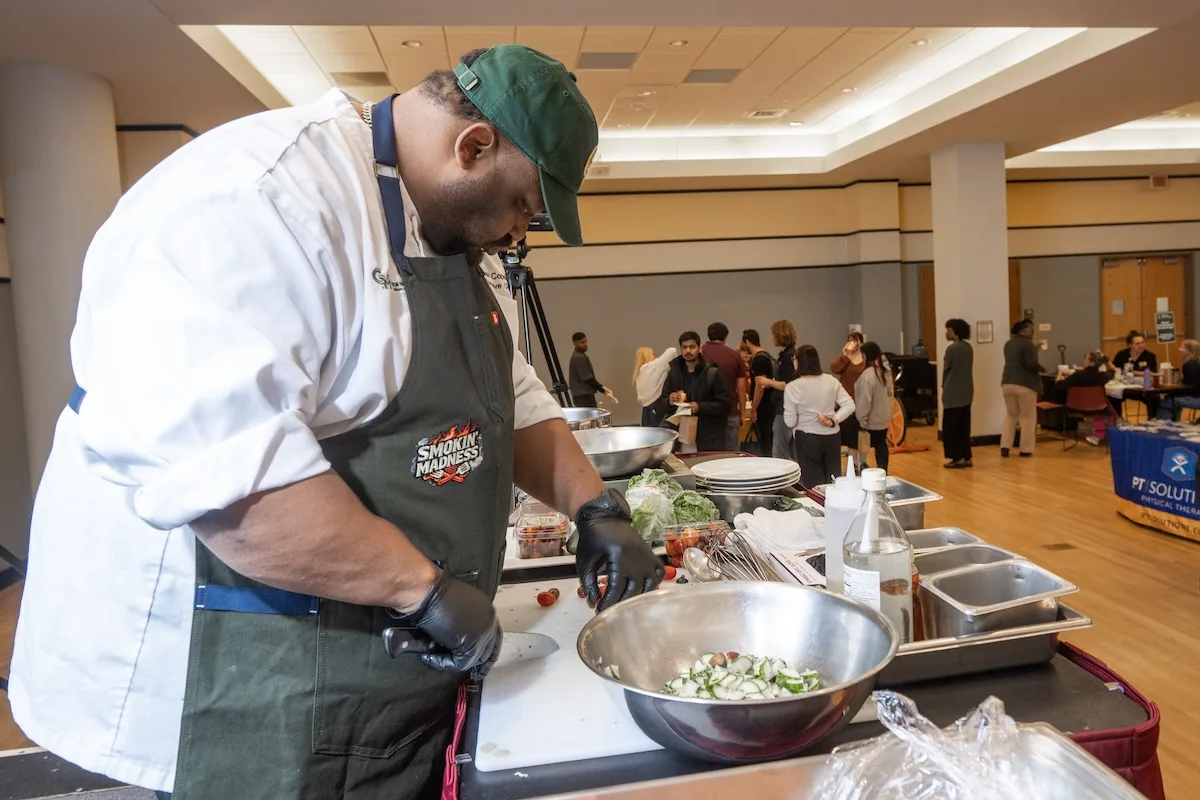 Mason Dining chefs prepare food for the university community at the Health and Fitness Expo on the Fairfax Campus.