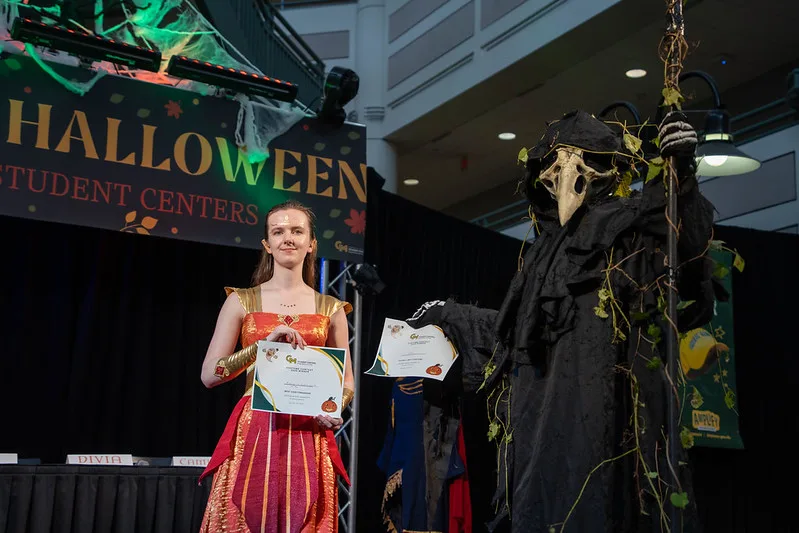 Student Halloween costume contest winners posed for a photo.