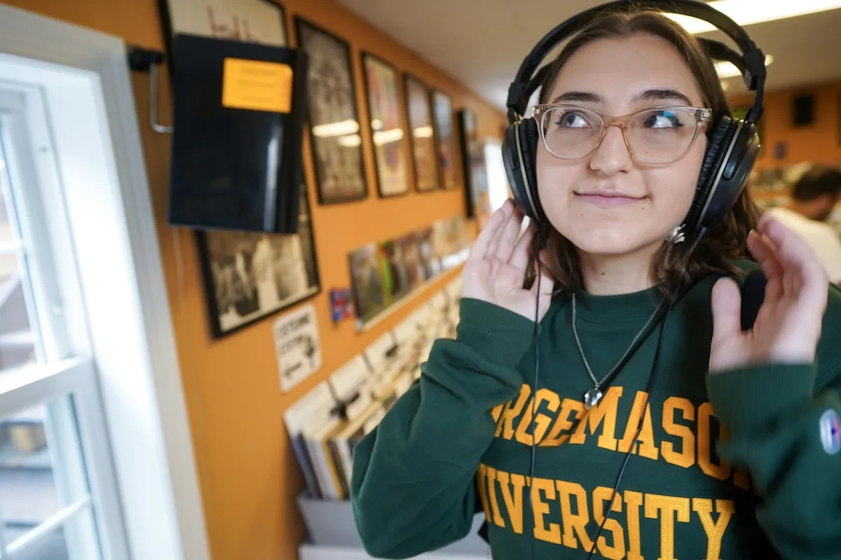 A student wearing a headphone