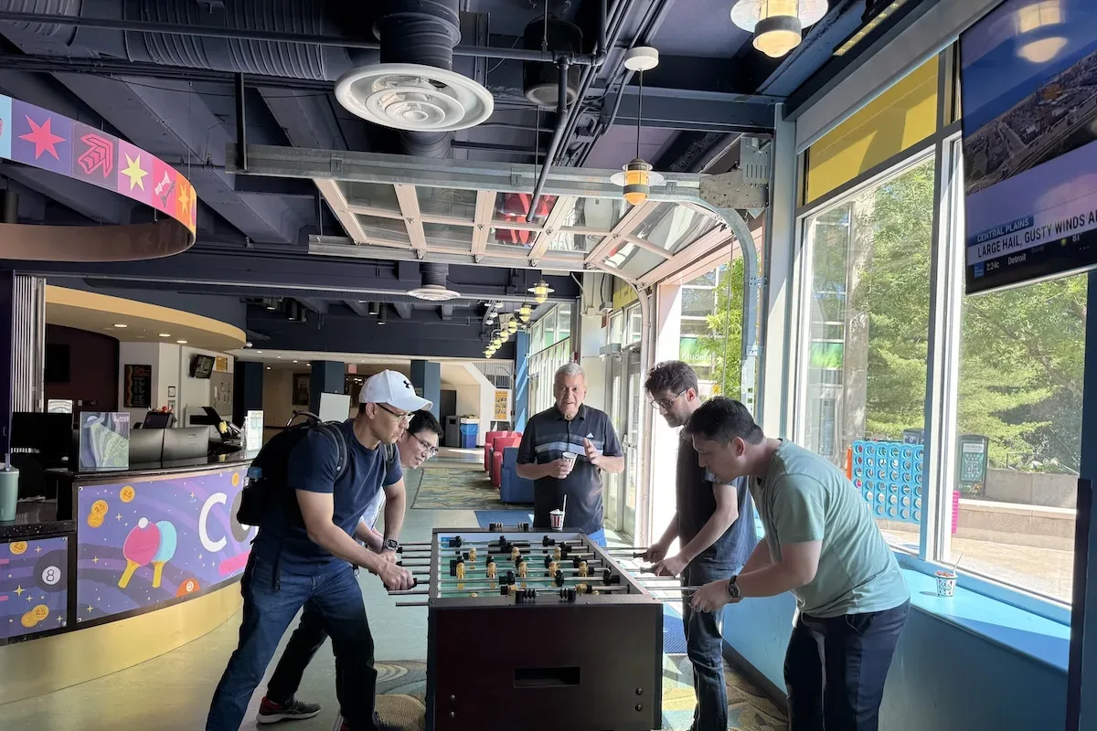 ITS staff enjoy playing the foosball at the Corner Pocket