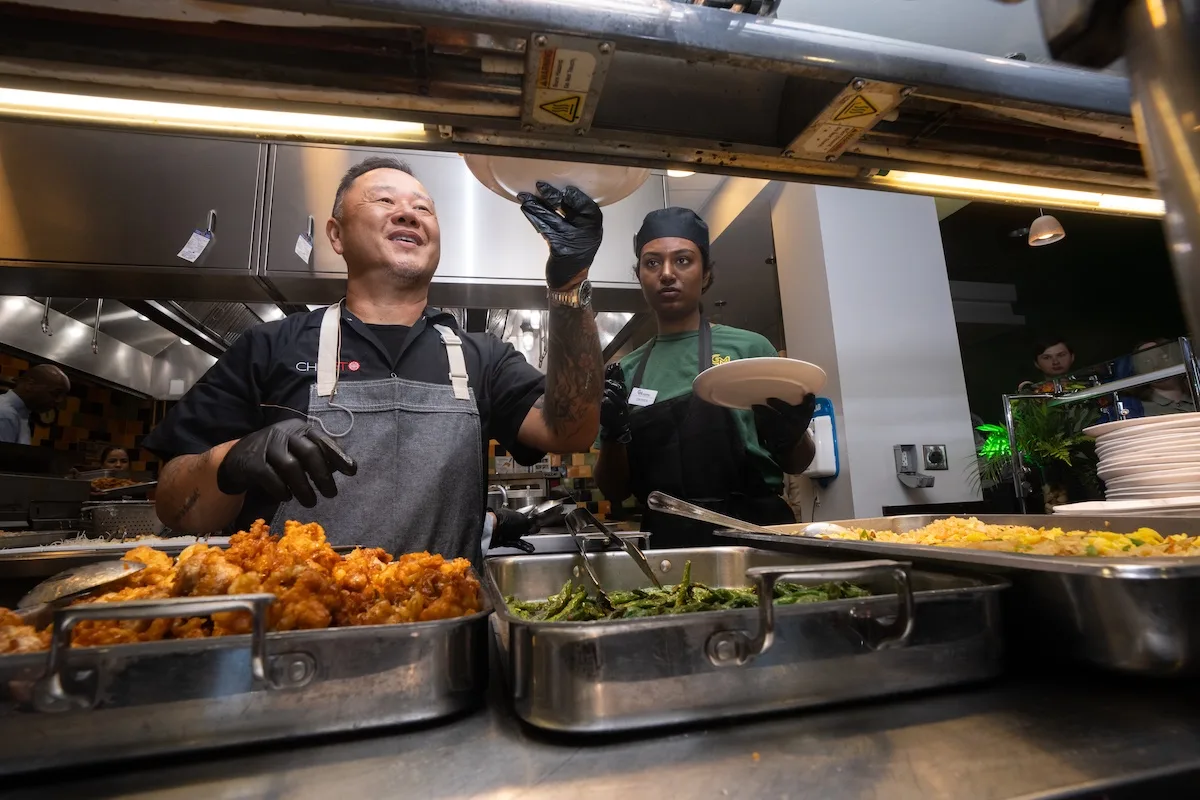 Chef Jet Tila and Southside Dining chefs prepare and cook Orange Flavored Chicken Thighs, Nasi Goreng, Fried Rice, Green Beans Szechuan Style for students on the Fairfax Campus.