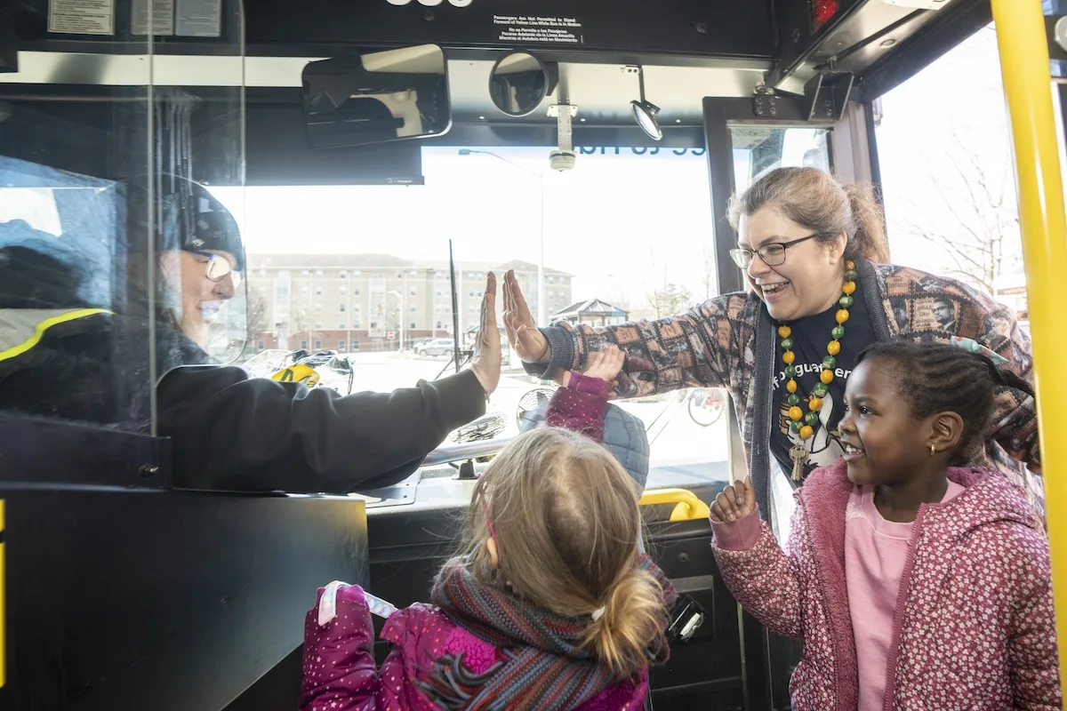 Mason Police and the Child Development Center will partner again this year to celebrate Transit Driver Appreciation Day on Wednesday, 3/18, and honor all the bus drivers. At the main bus/shuttle stops on the Fairfax Campus, they will hand out 30 gift bags to the drivers of Mason Shuttle/Reston Limo, CUE, Fairfax Connector, and Metro bus.  Photo by Evan Cantwell/George Mason University