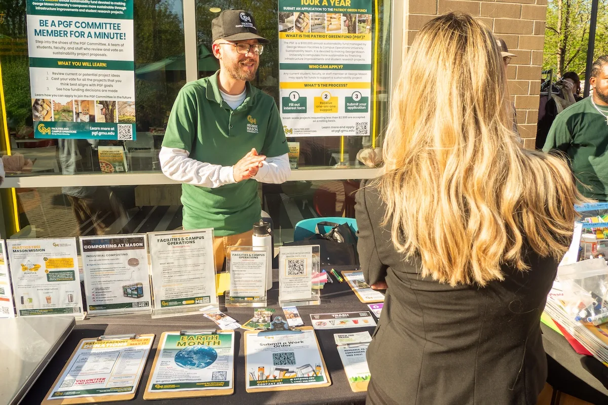 Facilities staff share information about the sustainability initiative at the Mason Dining's WastED event