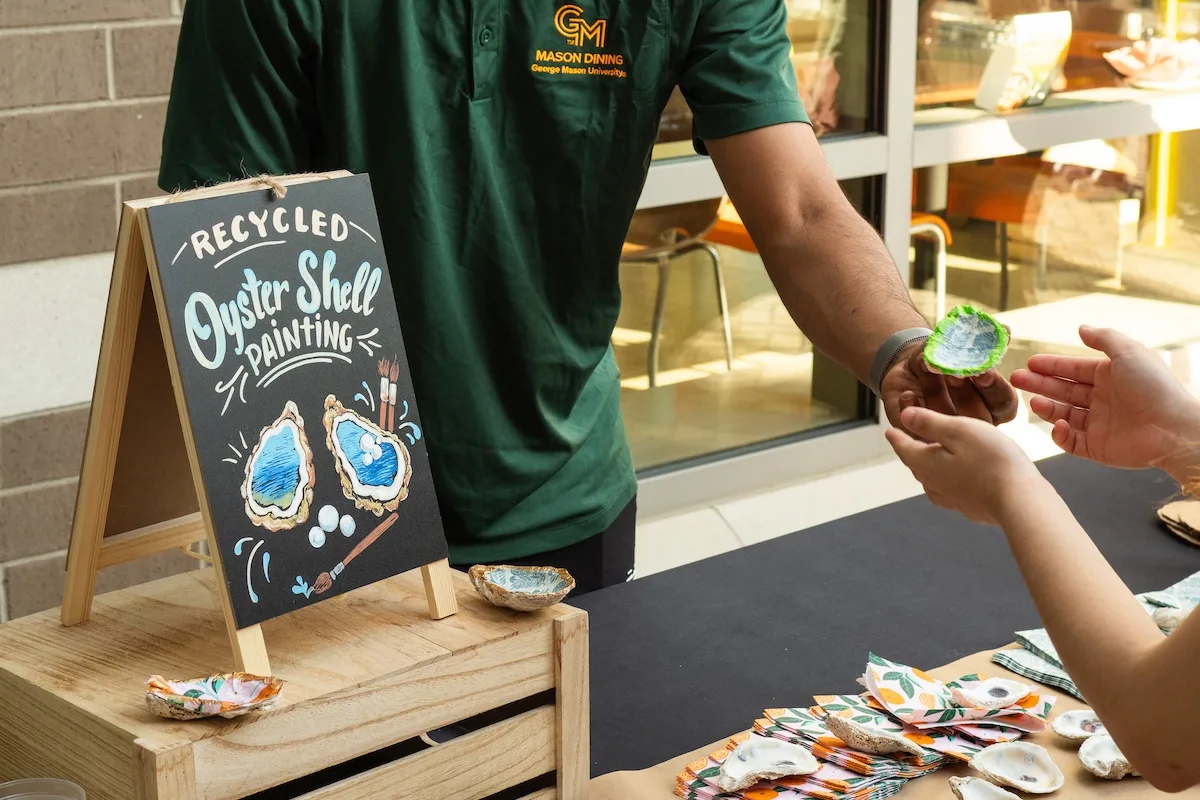Mason Dining staff handed out used oyster shell for a painting project