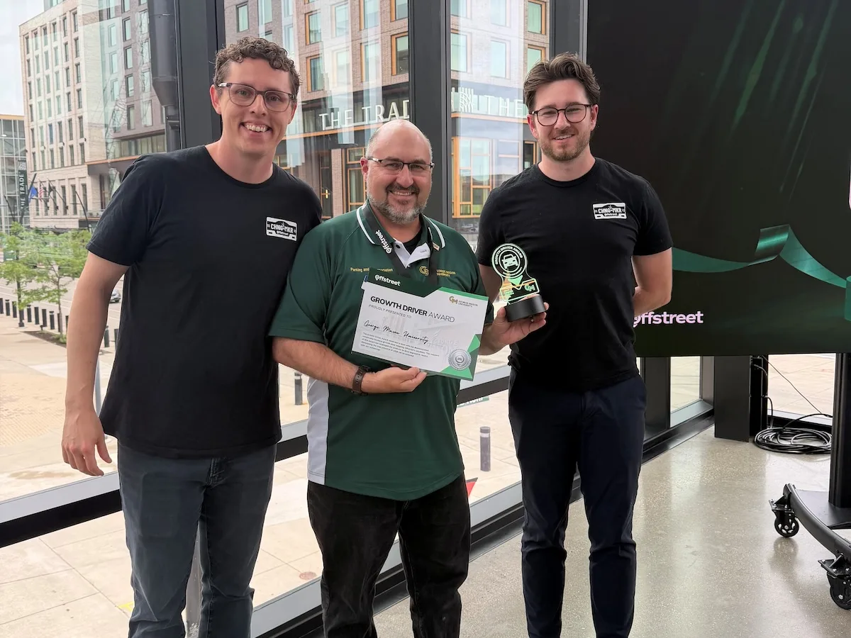 Photo of Josh Cantor, director of Parking and Transportation of George Mason University received the award from the Off-Street parking team.